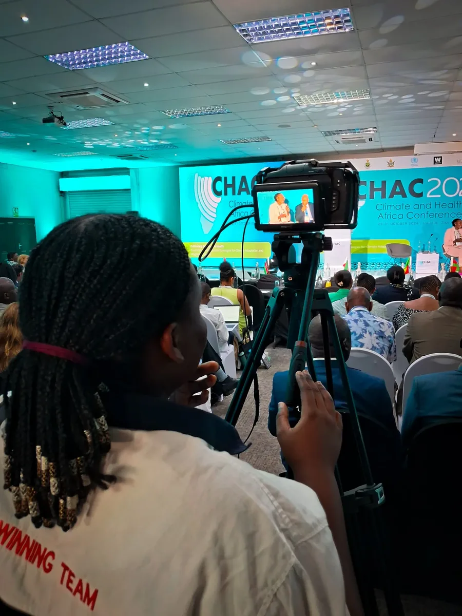 Tigzozo Media camera operator filming at an event